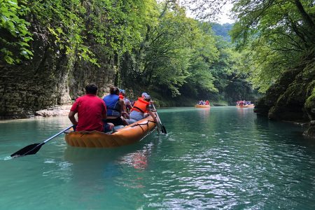 A group of people rafting in the beautiful Martvili Canyon in Samegrelo region, Georgia with EVANI Travel. 11 Days/10 Nights Tour Package in Georgia